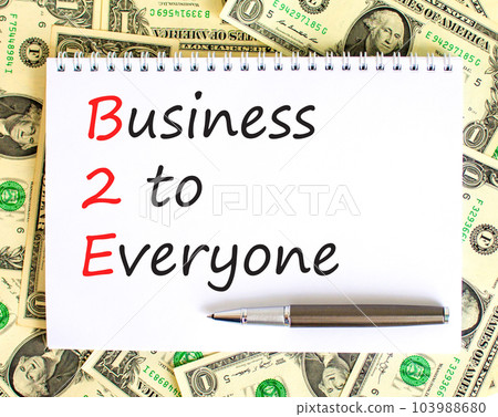 B2E business to everyone symbol. Concept words B2E business to everyone on white note on a beautiful background from dollar bills. Business and B2E business to everyone concept. Copy space. B2E business to everyone symbol. Concept words B2E business to everyone on white note on a beautiful background from dollar bills. Business and B2E business to everyone concept. Copy space. 103988680