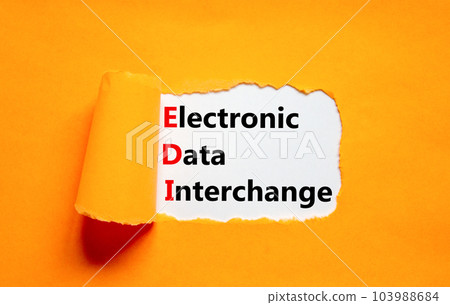 EDI electronic data interchange symbol. Concept words EDI electronic data interchange on white paper on a beautiful orange background. Business and EDI electronic data interchange concept. Copy space. EDI electronic data interchange symbol. Concept words EDI electronic data interchange on white paper on a beautiful orange background. Business and EDI electronic data interchange concept. Copy space. 103988684