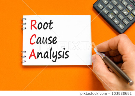 RCA root cause analysis symbol. Concept words RCA root cause analysis on white note. Businessman hand. Beautiful orange table orange background. Business RCA root cause analysis concept. Copy space. RCA root cause analysis symbol. Concept words RCA root cause analysis on white note. Businessman hand. Beautiful orange table orange background. Business RCA root cause analysis concept. Copy space. 103988691