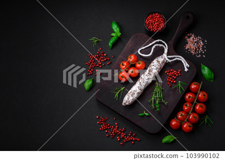 Delicious fresh smoked fuet sausage with salt, spices and herbs Delicious fresh smoked fuet sausage with salt, spices and herbs 103990102