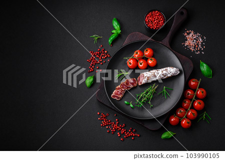 Delicious fresh smoked fuet sausage with salt, spices and herbs Delicious fresh smoked fuet sausage with salt, spices and herbs 103990105