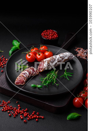 Delicious fresh smoked fuet sausage with salt, spices and herbs Delicious fresh smoked fuet sausage with salt, spices and herbs 103990107