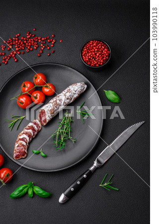 Delicious fresh smoked fuet sausage with salt, spices and herbs Delicious fresh smoked fuet sausage with salt, spices and herbs 103990118