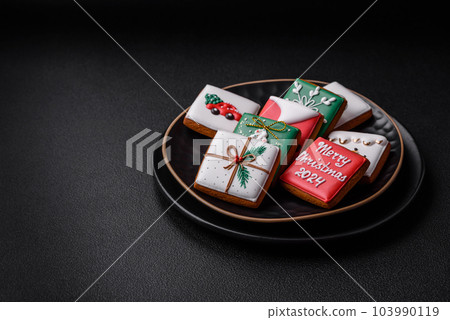 Delicious fresh sweet Christmas gingerbread with festive ornaments Delicious fresh sweet Christmas gingerbread with festive ornaments 103990119