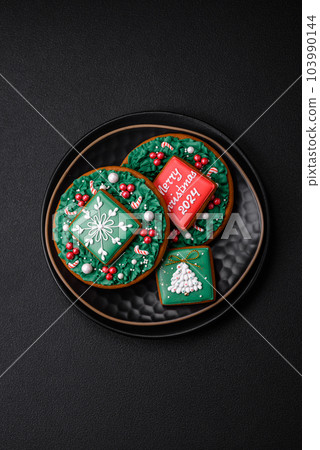 Delicious fresh sweet Christmas gingerbread with festive ornaments 103990144