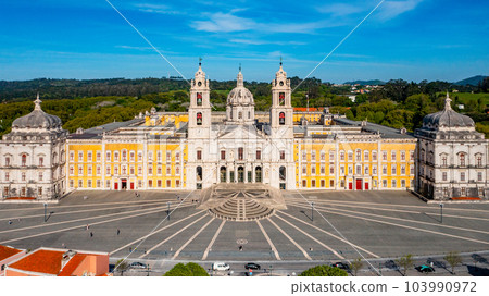 Aerial view of the Palace of Mafra. Unesco world heritage in Portugal. Aerial top view of the Royal Convent and Palace of Mafra, baroque and neoclassical palace. Drone view of a historic castle. Aerial view of the Palace of Mafra. Unesco world heritage in Portugal. Aerial top view of the Royal Convent and Palace of Mafra, baroque and neoclassical palace. Drone view of a historic castle. 103990972