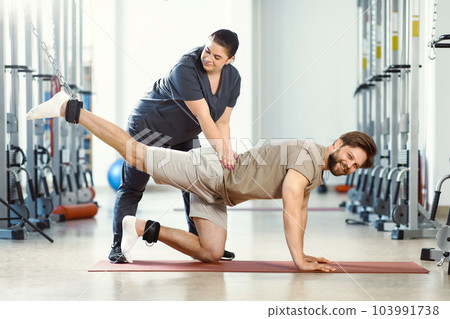 Rehabilitation therapy, therapeutic exercises, back strengthening, physical therapy. Rehabilitation approach for individuals with injuries. Therapeutic strategies for injury recovery. Restorative care 103991738