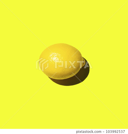Fresh lemon lies horizontally on a yellow background 103992537