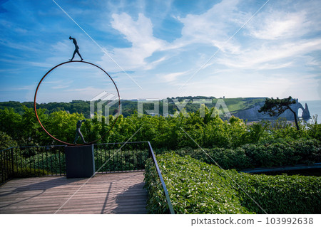 Part of statue in Etretat gardens and bamboo trees Part of statue in Etretat gardens and bamboo trees 103992638