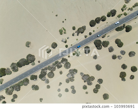 road with cars in desert, Teide national park, Tenerife, Canary island, aerial road with cars in desert, Teide national park, Tenerife, Canary island, aerial 103993691
