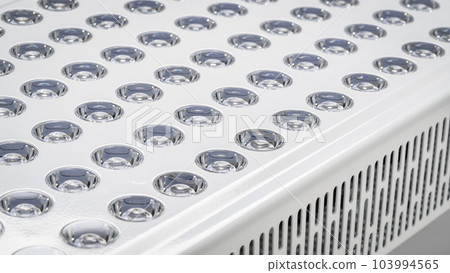 detail of red light therapy panel for skin health, pain relief, recovery and muscle performance and inflammation reduction, lights off detail of red light therapy panel for skin health, pain relief, recovery and muscle performance and inflammation reduction, lights off 103994565