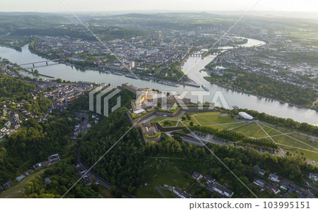 Wide Aerial Drone Shot of Ehrenbreitstein Fortress on the river rhine in Koblenz in evening, Rheinland-Pfalz, Germany 103995151