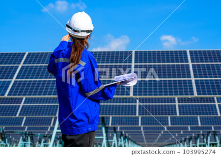 Engineer worker portrait with solar panel at solar farm Engineer worker portrait with solar panel at solar farm 103995274