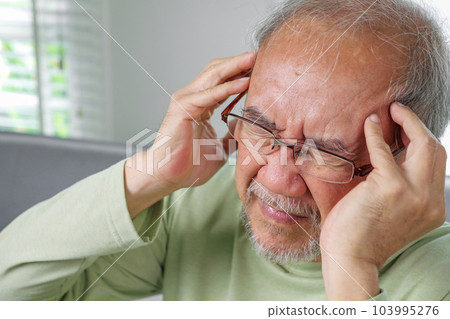 Elderly upset with headache, Senior constipation hand touch head Elderly upset with headache, Senior constipation hand touch head 103995276