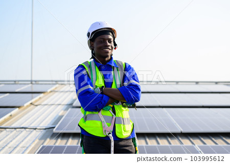 Smiling portrait of happy engineer technician working on rooftop Smiling portrait of happy engineer technician working on rooftop 103995612