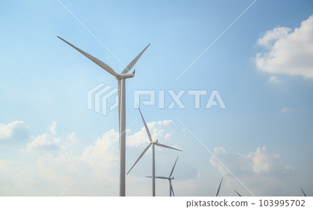 Windmill industrial farm with cloud and a blue sky, Wind turbine field 103995702