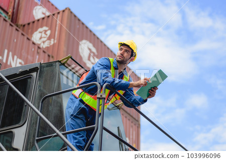 Warehouse engineer worker working at industrial container yard 103996096