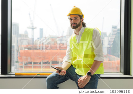 Portrait of smart engineer foreman with safety helmet and vest Portrait of smart engineer foreman with safety helmet and vest 103996118