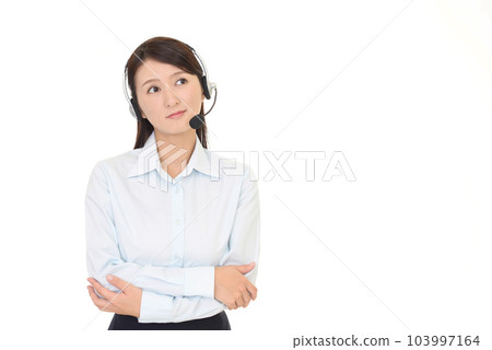 Thinking female operator Thinking female operator 103997164