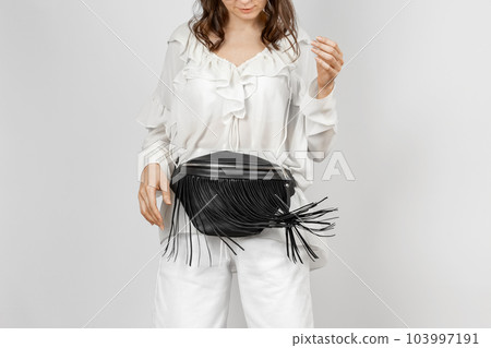 Woman with Black Leather Crossbody Fanny Pack Bag 103997191