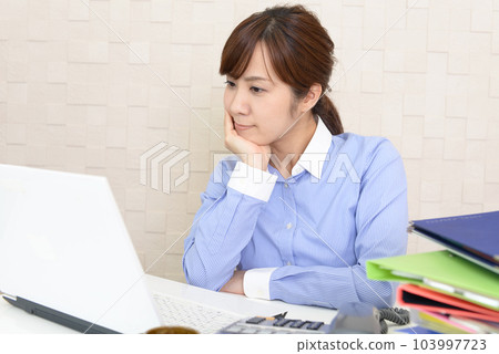 Office lady tired from computer work 103997723
