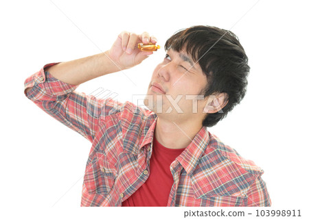 A man who stands for eye drops A man who stands for eye drops 103998911