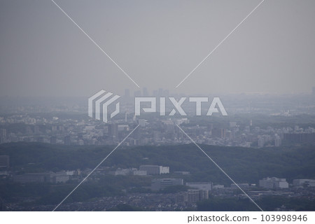 Hazy Shinjuku buildings seen from Mt. Takao Hazy Shinjuku buildings seen from Mt. Takao 103998946