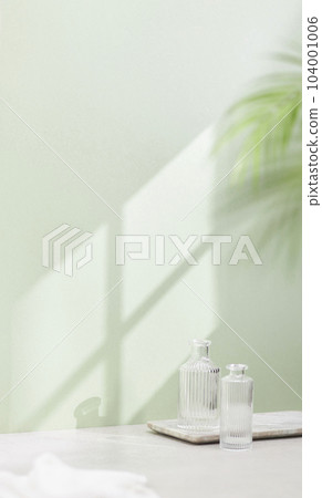 Vases and objects on the table in a warm room with sunlight coming in 104001006