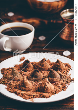 Chocolate truffles coated in cocoa powder Chocolate truffles coated in cocoa powder 104002065