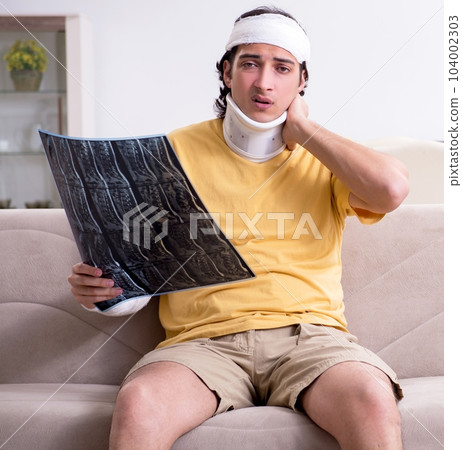 Young man after accident recovering at home Young man after accident recovering at home 104002303