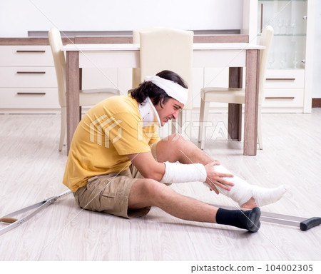 Young man after accident recovering at home Young man after accident recovering at home 104002305