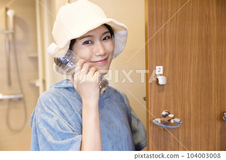 Sauna girls preparing to enter the sauna in the locker room 104003008