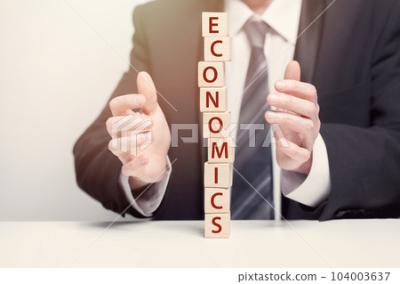 Wooden cubes with word, fragile business economics concept 104003637