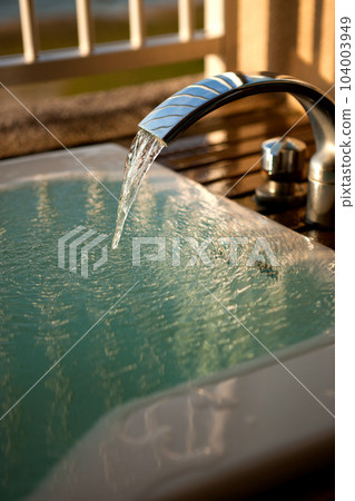 An image of a stylish open-air bath in the evening An image of a stylish open-air bath in the evening 104003949