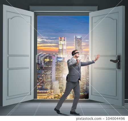 Blindfold businessman in uncertainty concept Blindfold businessman in uncertainty concept 104004496