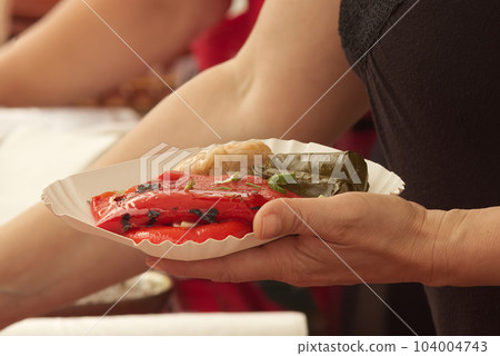 Selling Balkan and Mediterranean specialities, baked peppers and stuffed cabbage and vine leaves 104004743