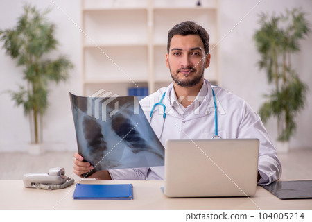 Young male doctor radiologist working in the clinic Young male doctor radiologist working in the clinic 104005214