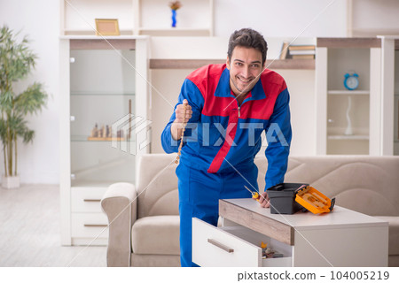 Young male carpenter stealing jewelry at home 104005219