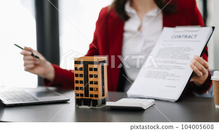 Considering buying a home, investing in real estate. Broker signs a sales agreement. agent, lease agreement, successful deal in office.. Considering buying a home, investing in real estate. Broker signs a sales agreement. agent, lease agreement, successful deal in office.. 104005608