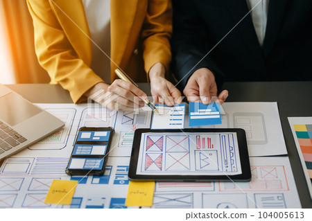 UX graphic designer planning application process development prototype wireframe for web smart phone. Creative digital development agency.. UX graphic designer planning application process development prototype wireframe for web smart phone. Creative digital development agency.. 104005613