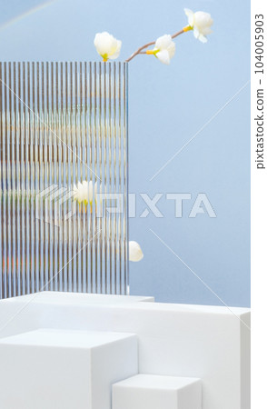 White block pedestal product display blue background with modern Transparency strip glass and flower with sunshine light White block pedestal product display blue background with modern Transparency strip glass and flower with sunshine light 104005903