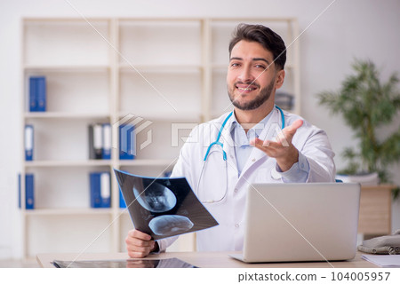 Young male doctor radiologist working in the clinic 104005957