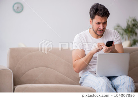 Young man starting day at home Young man starting day at home 104007886