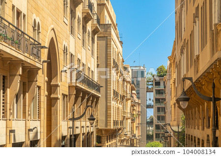 Old Beirut central downtown narrow street architecture with buildings and street lights on both sides, Lebanon 104008134