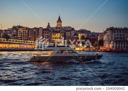 Istanbul city skyline in Turkey, Beyoglu district old houses with Galata tower on top, view from the Golden Horn 104009042