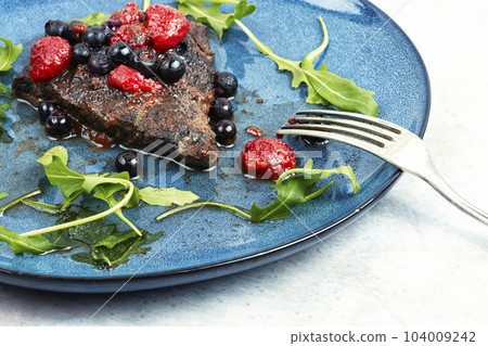 Meat with berry sauce. 104009242