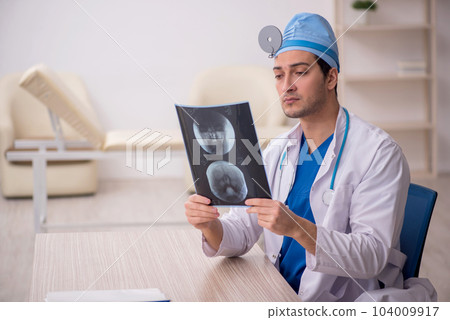 Young male doctor radiologist working in the clinic Young male doctor radiologist working in the clinic 104009917