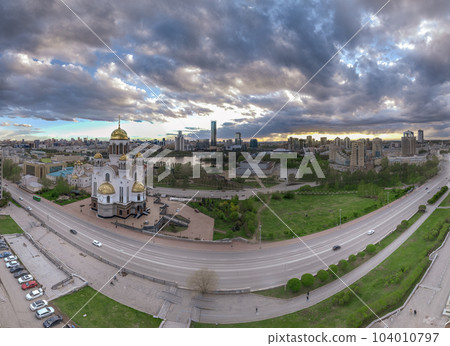 Summer Yekaterinburg and Temple on Blood in cloudy sunset. Aerial view of Yekaterinburg, Russia. Translation of the text on the temple 104010797