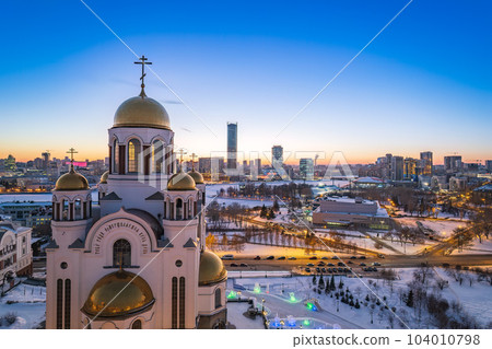 Winter Yekaterinburg and Temple on Blood in beautiful blue clear sunset. Aerial view of Yekaterinburg, Russia. Translation of the text on the temple 104010798