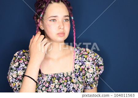 girl with brown hair and pigtails braided with artificial hair braiding girl with brown hair and pigtails braided with artificial hair braiding 104011563